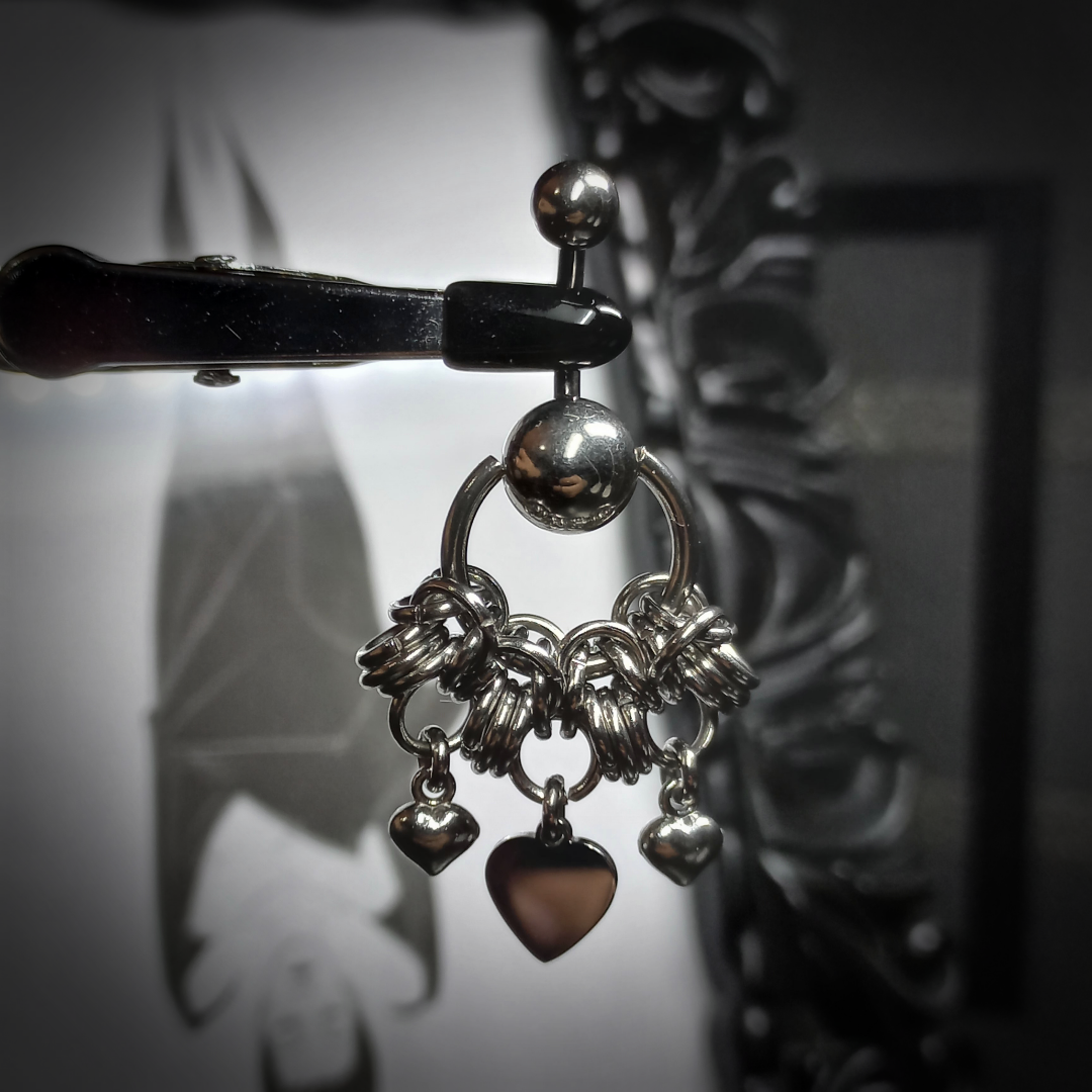 Heart-shaped belly button piercing